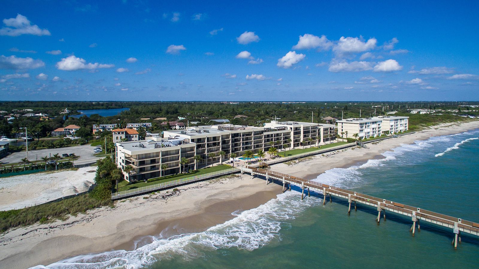 Aerial view of Vero Beach barrier island oceanfront with fishing pier
