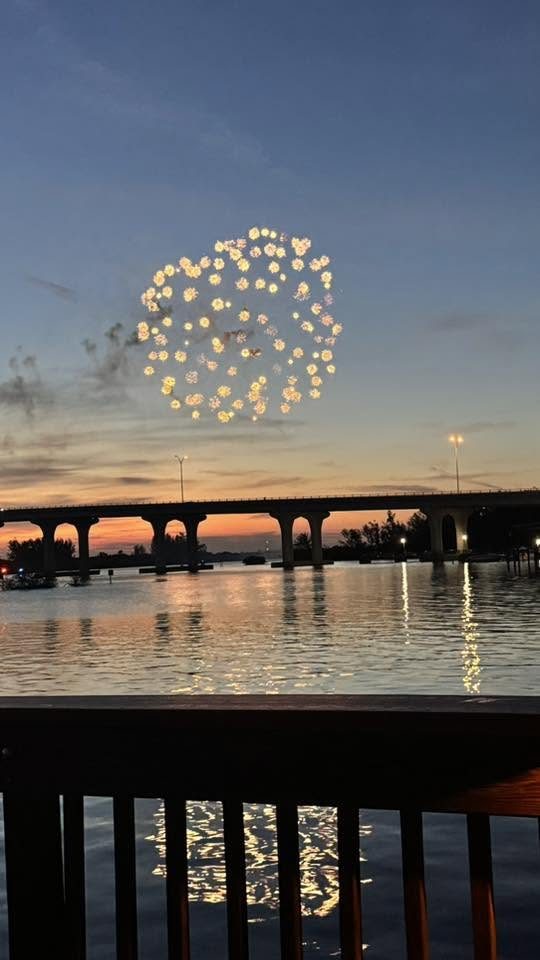Fireworks over the Merrill Barber Bridge, Vero Beach, at dusk